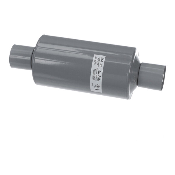 A cylindrical gray metal component with two pipe connections and a label on its side, photographed against a white background.