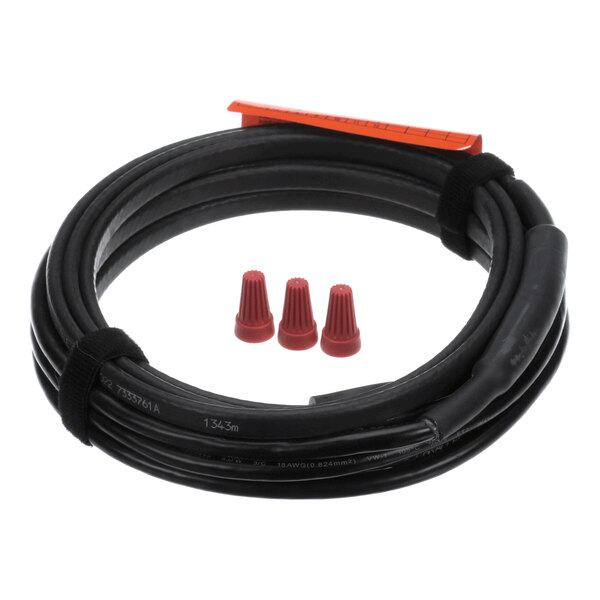 A coiled black cable with two black straps, an orange tag, and three small red wire connectors placed in the center.