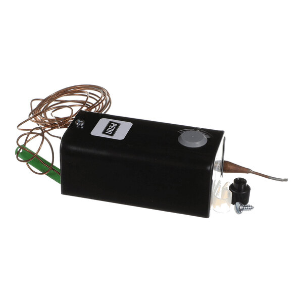 A black rectangular device with a coiled copper wire, a dial, and a protruding metal probe, accompanied by small mounting hardware.
