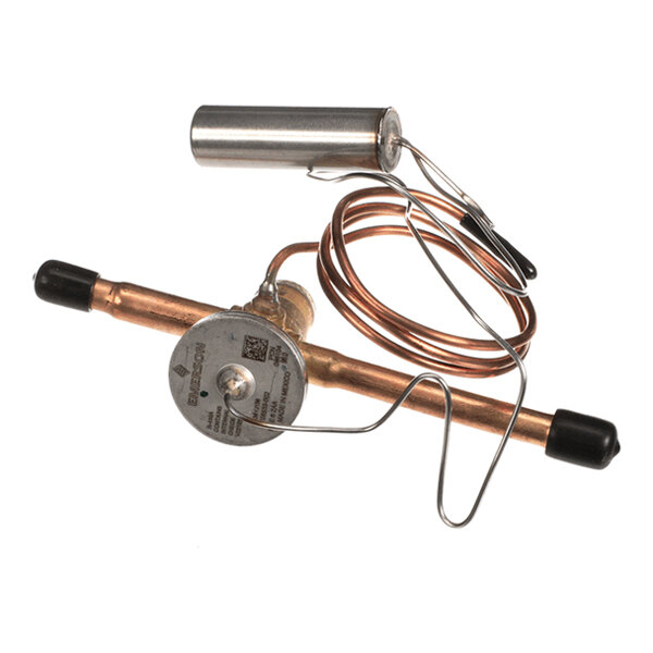 A copper and metal valve assembly with a coiled copper tube and cylindrical component, featuring black caps on both ends.