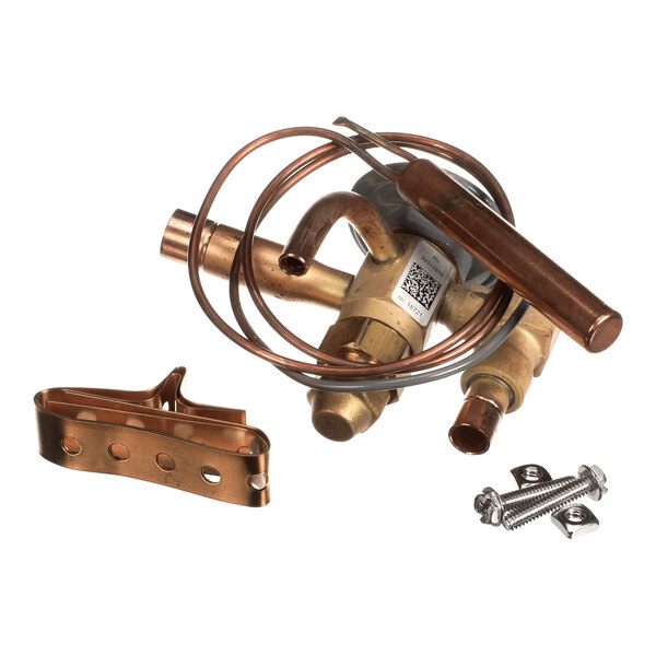 A metal valve assembly with copper tubing, a bracket, and screws, likely part of a refrigeration or HVAC system.