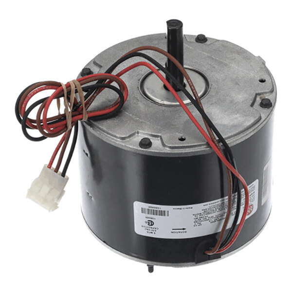 A cylindrical electric motor with attached wires and a connector, featuring a central shaft and a label on the side.