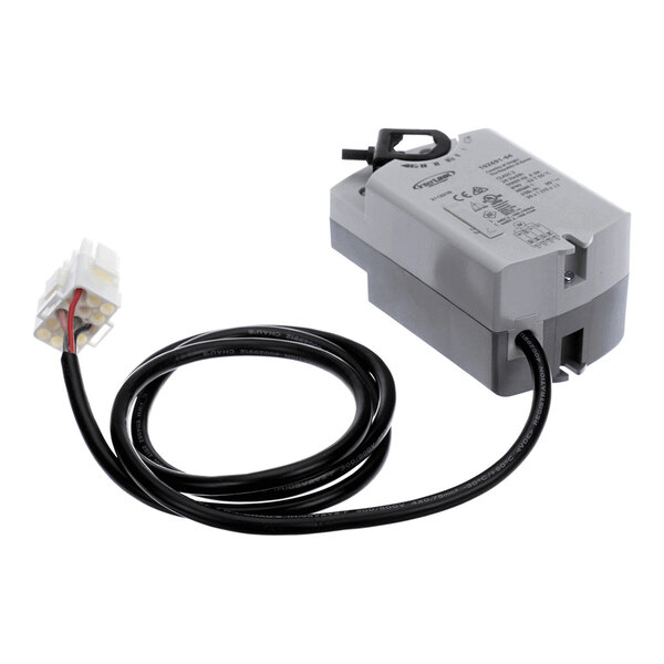 A gray rectangular electronic device with a black cable attached, ending in a white multi-pin connector.