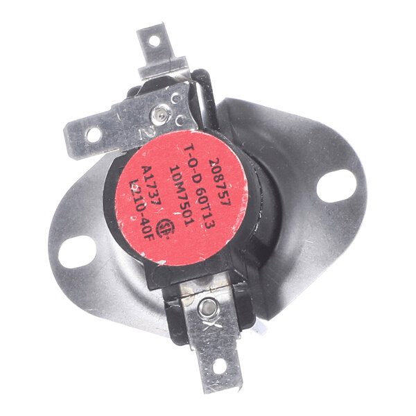 A metal and plastic electrical component with a red circular label, two mounting holes, and three metal terminals.