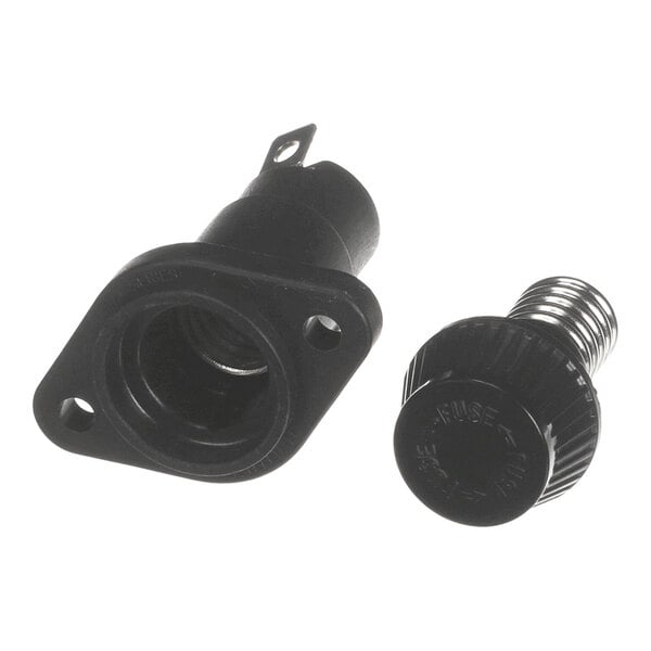A black plastic fuse holder with a removable cap and spring, shown disassembled.