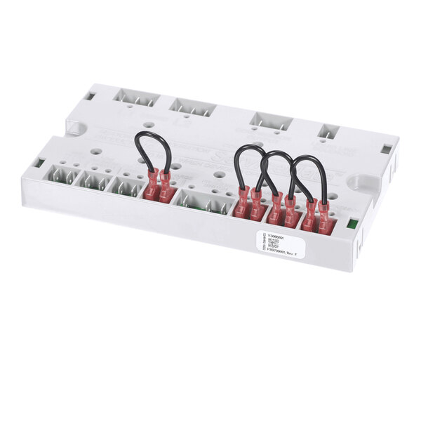 A rectangular white electrical component with multiple terminal connections and several black jumper wires attached to red connectors.