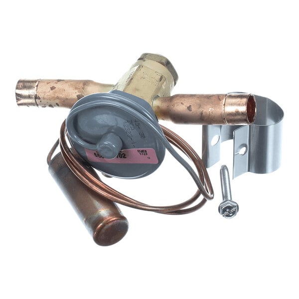 A brass and copper valve assembly with attached coiled tubing, a cylindrical component, a metal mounting bracket, and a screw.
