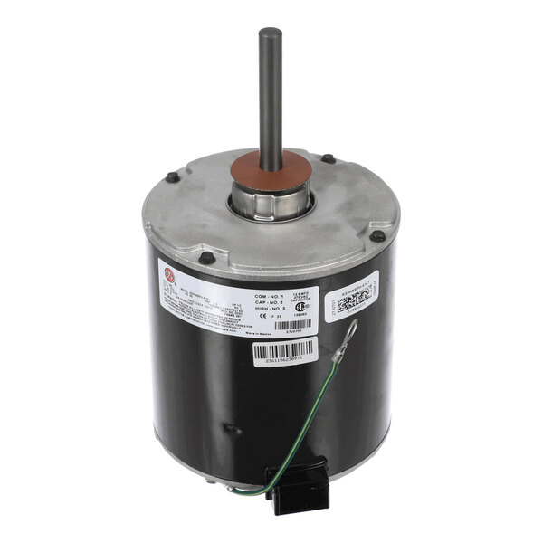 A cylindrical electric motor with a metal shaft protruding from the top and a label with technical information on the side.