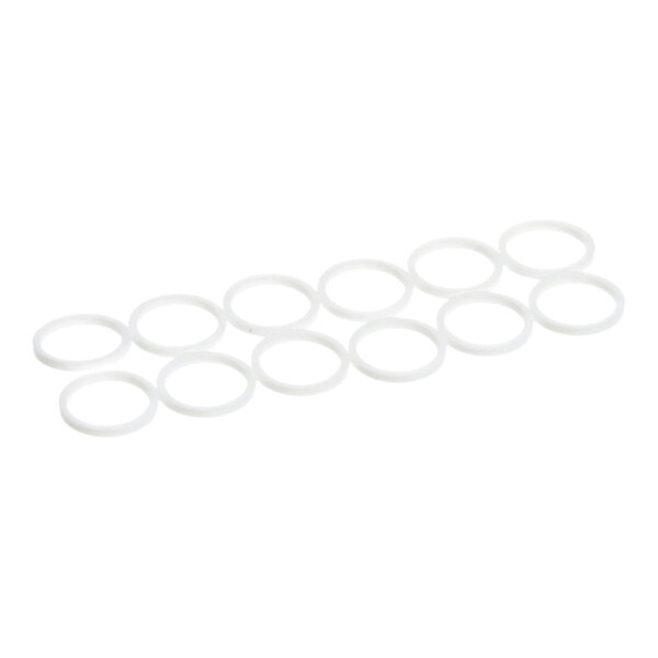 Twelve white, circular, flat washers are arranged in a staggered pattern on a white background.