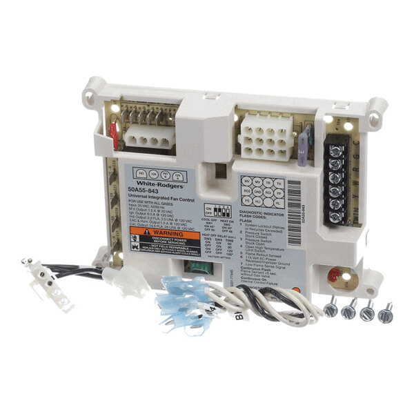 A rectangular electronic control module with multiple connectors, wiring, and labeled terminals, accompanied by screws and wire connectors.