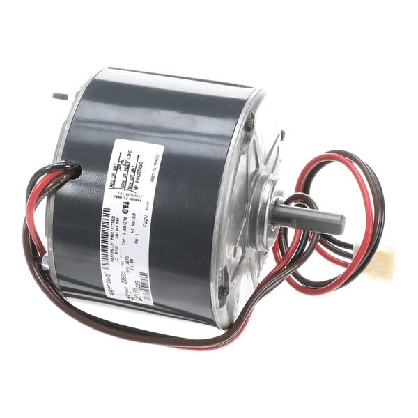 A cylindrical electric motor with attached wires and a visible label, featuring a central shaft protruding from one end.