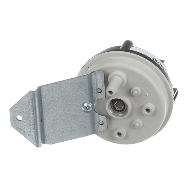 A round pressure switch with a gray plastic body, multiple hose connection ports, and an attached metal mounting bracket.