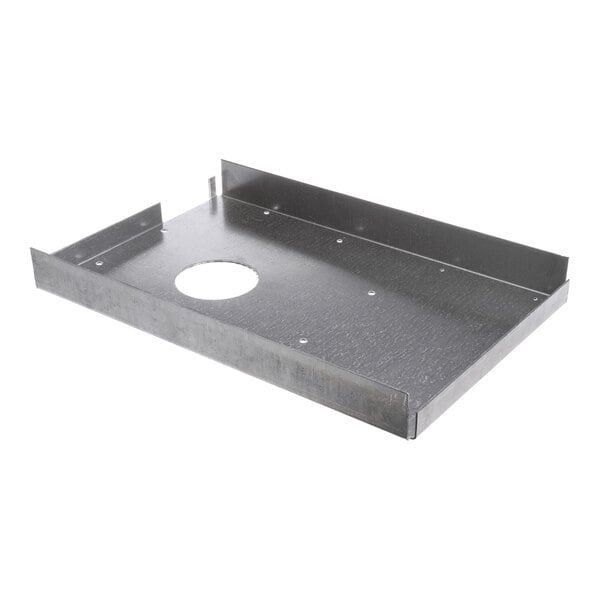 A rectangular metal plate with raised edges and a circular cutout in the center.