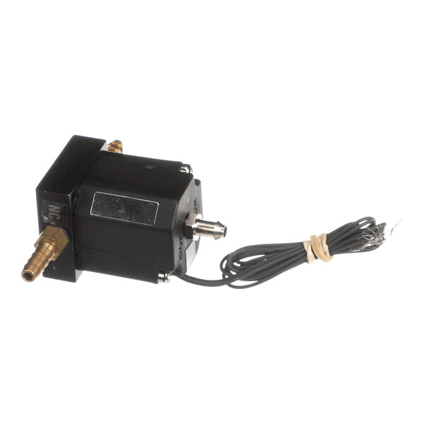 A black solenoid valve with brass fittings and attached electrical wiring, coiled and secured with a rubber band.