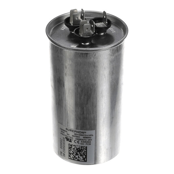 A cylindrical metallic component with three electrical terminals on top and a label with text and a QR code on the side.