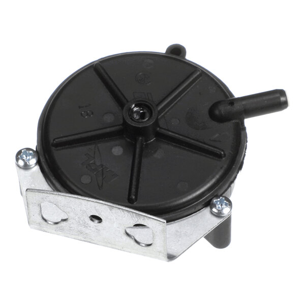 A round black plastic component with a metal mounting bracket and two hose connectors, likely an air pressure switch.
