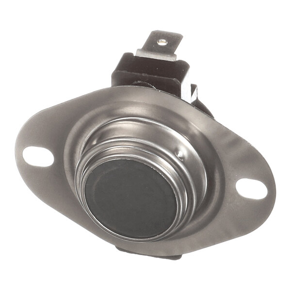 A metallic component with a circular center, two mounting holes, and an electrical connector on top.
