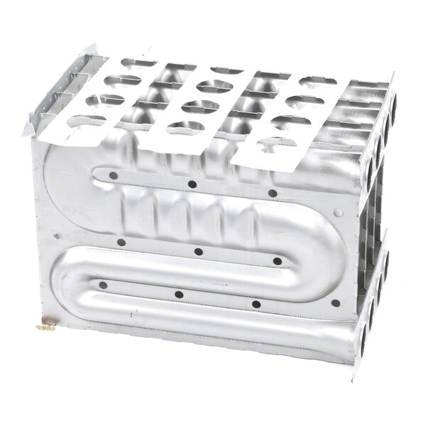 A rectangular metallic component with multiple circular openings on the top and sides, featuring a series of curved and straight channels embossed on its surface.