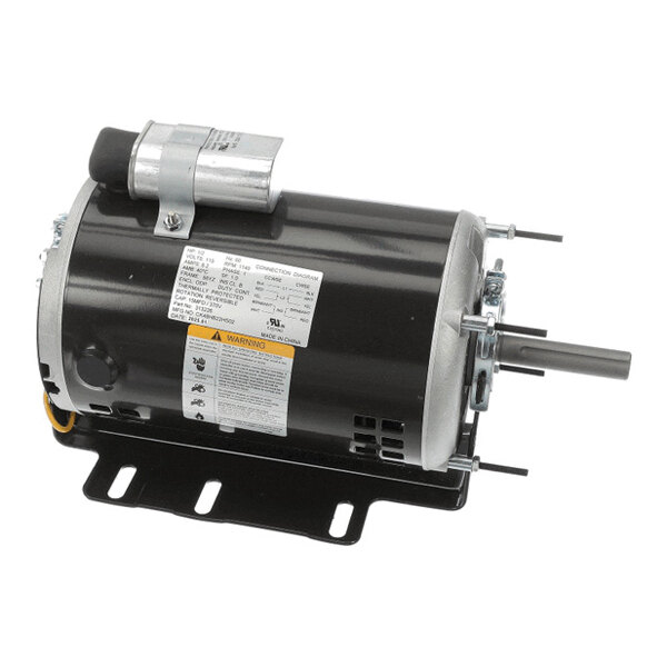 A cylindrical electric motor with a black housing, mounted on a metal base, featuring a protruding shaft and attached capacitor.