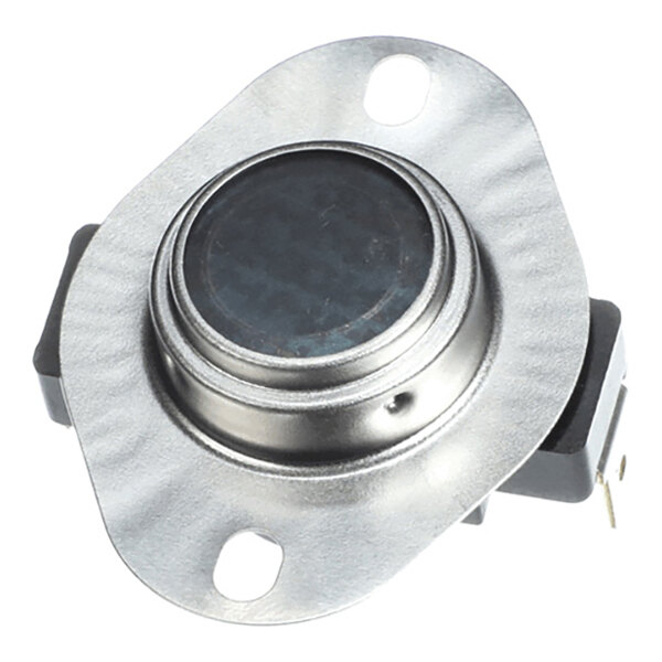 A close-up view of a metallic electronic component with a circular center and two mounting holes on a flat flange.