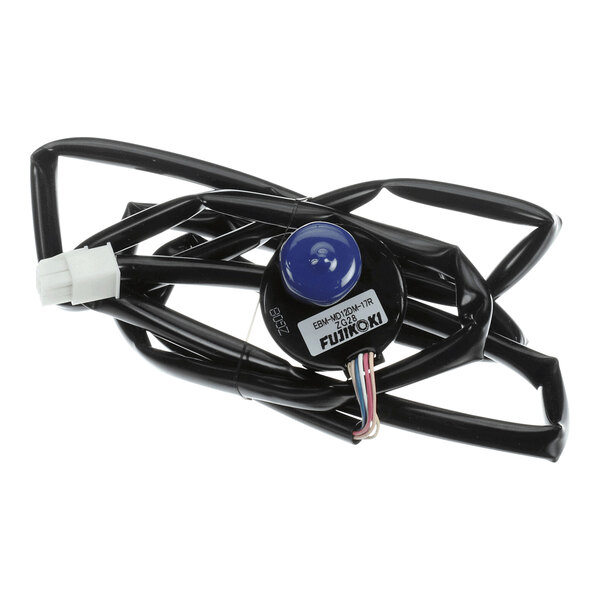 A coiled black cable with a round black and blue component and a white connector at one end.