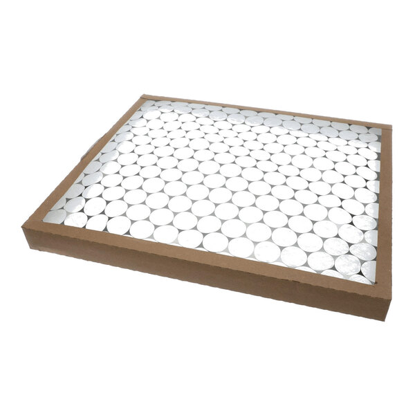A rectangular air filter with a cardboard frame and a grid of circular white filter material.