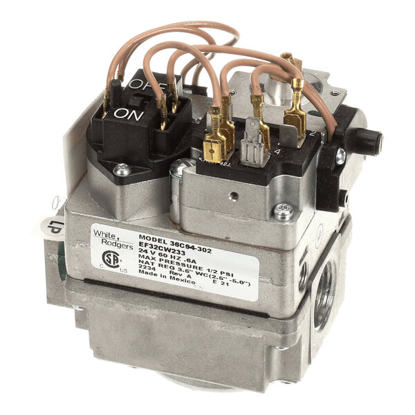 A metallic gas valve component with several attached wires, labeled terminals, and an ON/OFF switch visible on the top.