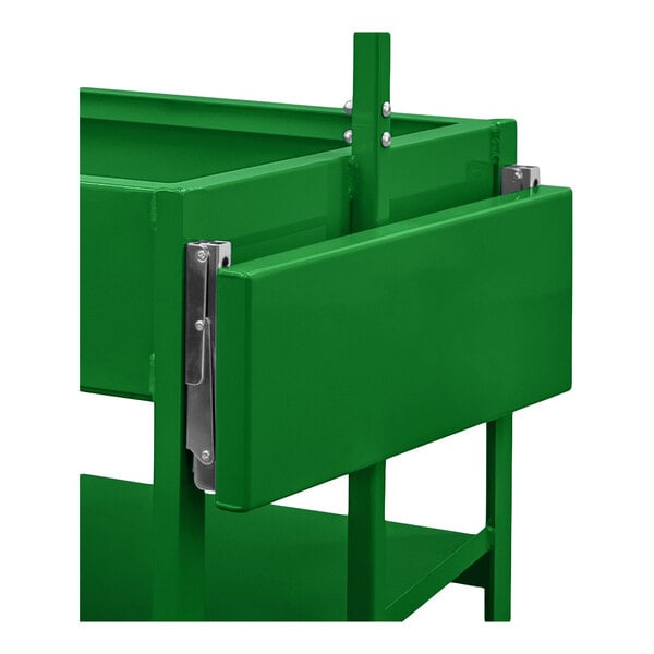 A close-up view of a green metal folding shelf attached to a frame with visible hinges and support brackets.