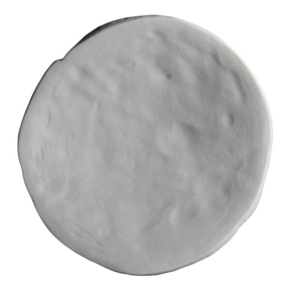 A round, white, slightly textured plate with a matte finish.