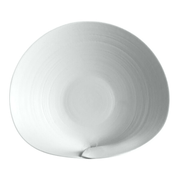 A round, white plate with a slightly irregular, organic shape and a subtle textured pattern.
