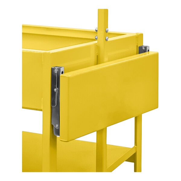 A close-up view of a yellow metal folding shelf attached to a larger yellow metal frame.