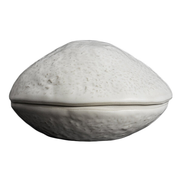 A white, textured, clam-shaped bowl with a matching lid.
