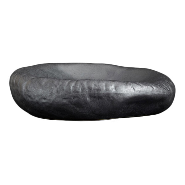 A shallow, round, black dish with a smooth, slightly irregular surface and a matte finish.