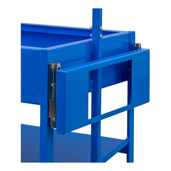 A close-up view of a blue metal folding shelf attached to a larger structure, featuring hinges and rectangular cutouts.