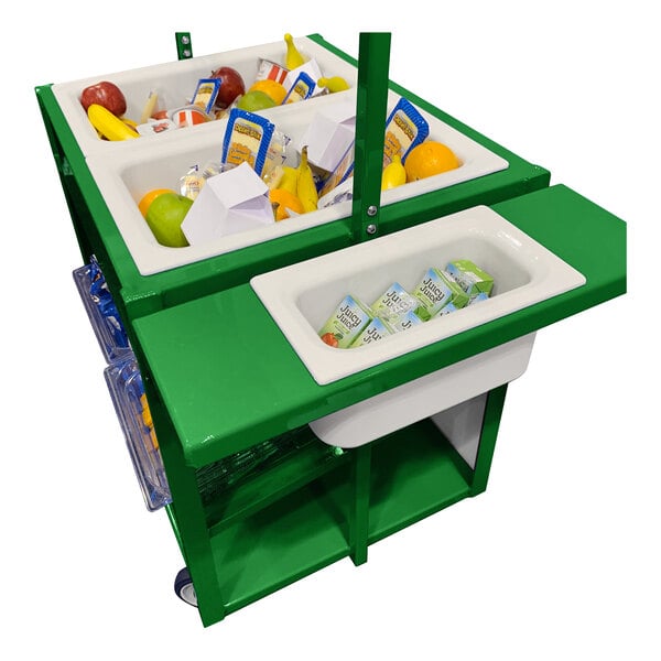 A green cart with white bins containing assorted packaged drinks, fruits, and snacks.