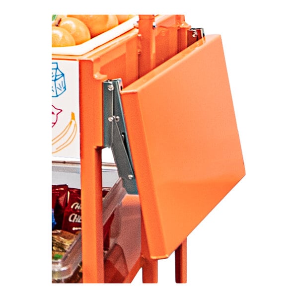 A close-up view of an orange folding metal shelf attached to a storage cart, with visible hinge hardware.