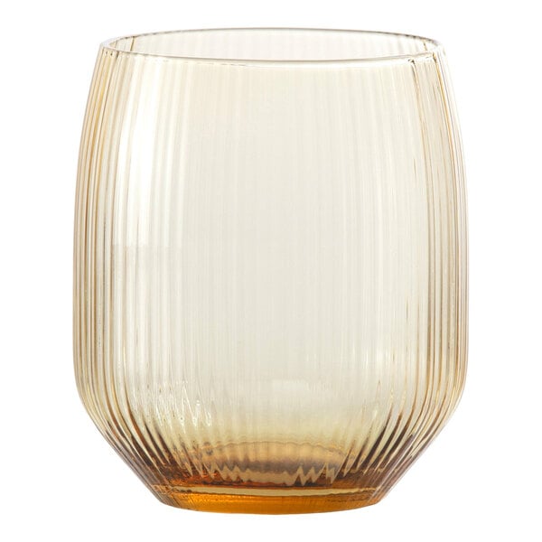 A ribbed, translucent glass tumbler with a subtle amber tint at the base.