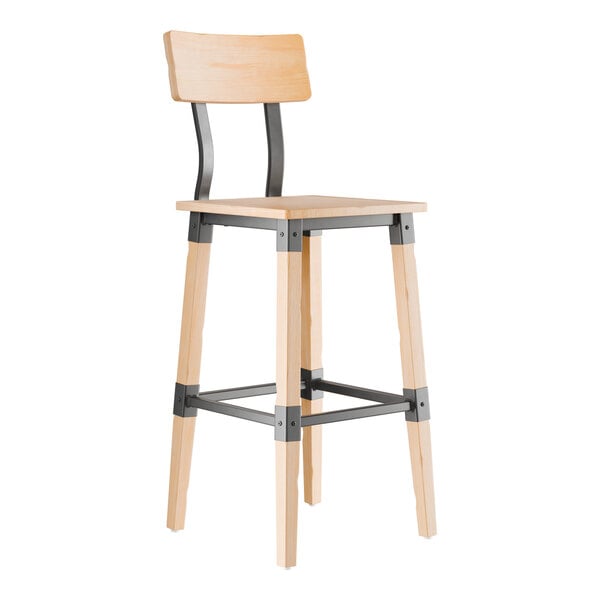 A wooden bar stool with a light bleached oak finish, featuring a square seat, a rectangular backrest, and black metal supports connecting the legs and back.