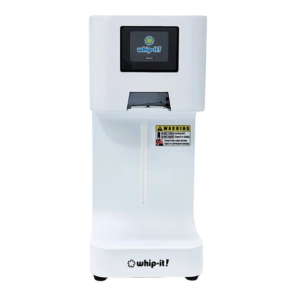 A white, rectangular automatic machine with a digital display, a warning label, and the 'whip-it!' logo on the front.