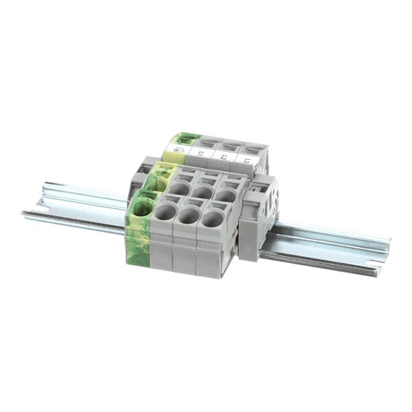 A gray modular terminal block assembly mounted on a metal DIN rail, with multiple circular wire entry points and a section marked with green and yellow coloring.