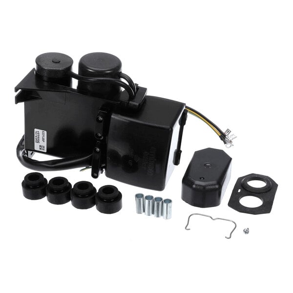 A black electrical component with attached wires, several cylindrical rubber grommets, metal sleeves, a cover, a gasket, and small hardware pieces arranged on a white background.