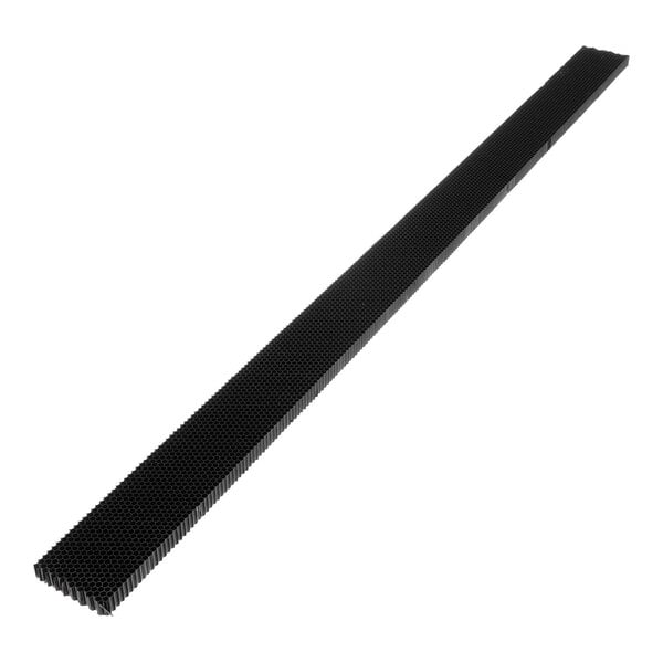 A long, narrow black object with a honeycomb-like grid pattern along its length.
