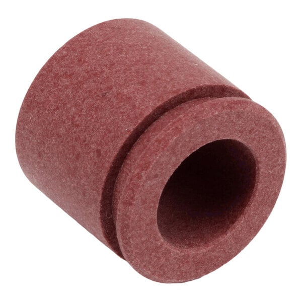 A cylindrical, reddish-brown component with a central hole and a groove around its outer surface.
