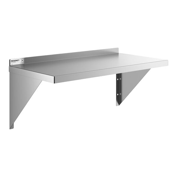 A stainless steel heavy duty wall shelf with triangular support brackets and a raised back edge.