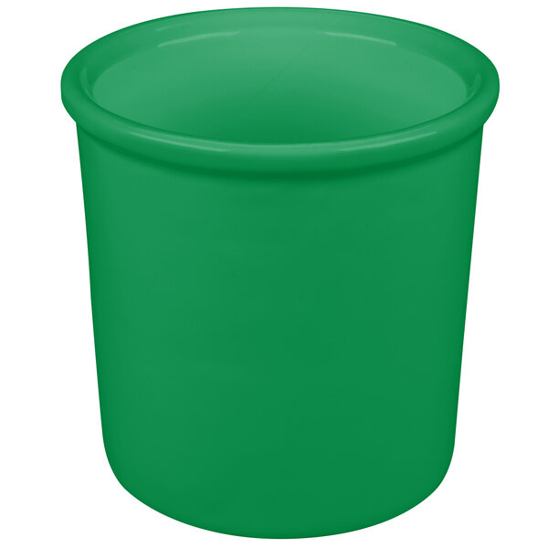 A green cast aluminum condiment bowl with a white background.