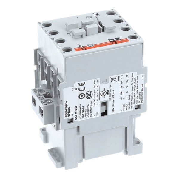 A gray electrical contactor with multiple connection points, labeled with technical specifications and certification marks on its side.
