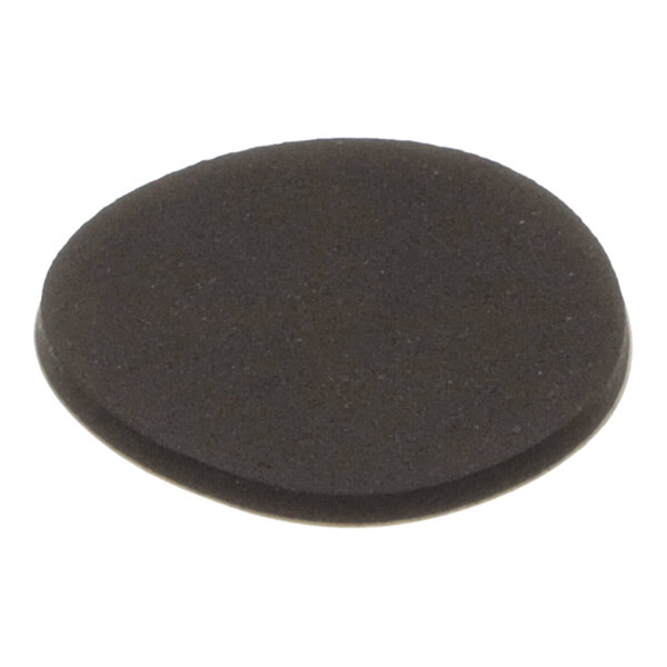 A round, flat, black pad with a slightly textured surface.