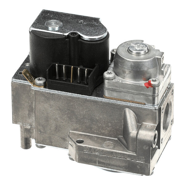 A metallic gas valve component with various connectors and a black plastic section, photographed against a white background.