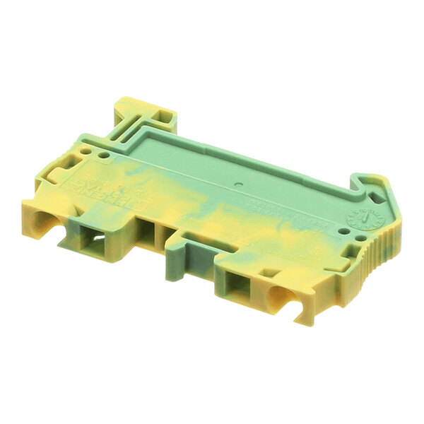 A green and yellow plastic component with multiple slots and a rectangular shape, likely part of an electrical or mechanical assembly.