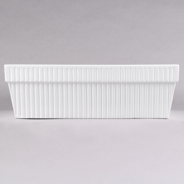 A white rectangular Tablecraft cast aluminum bowl with a ribbed pattern.